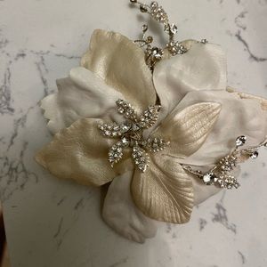 White and ivory flowered wedding hair piece.